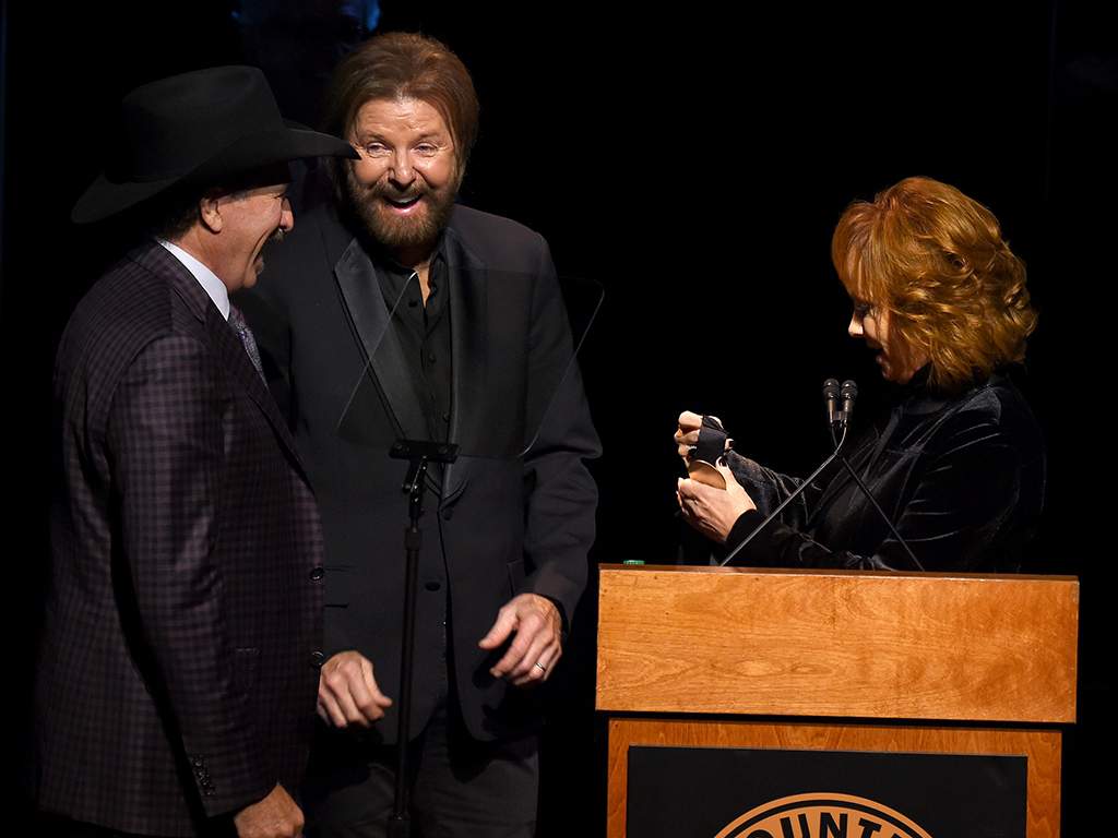 (L-R) Kix Brooks, Ronnie Dunn and Reba McEntire onstage at the 2019 Country Music Hall of Fame Medallion Ceremony held at the Country Music Hall of Fame & Museum on Oct. 20, 2019 in Nashville, Tenn.
