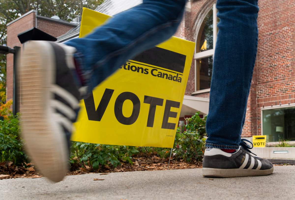 A man walks to a polling station in Toronto, on October 21 2019 to vote in the country's 43rd federal election.