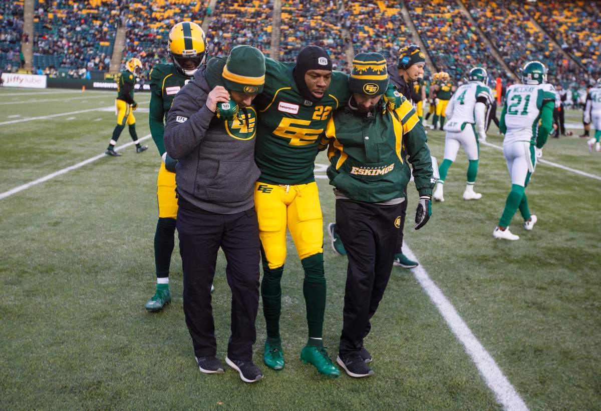 Edmonton Eskimos’ Christion Jones (22) is carried off the field after an injury against the Saskatchewan Roughriders during first half CFL action in Edmonton, Alta., on Saturday October 26, 2019.