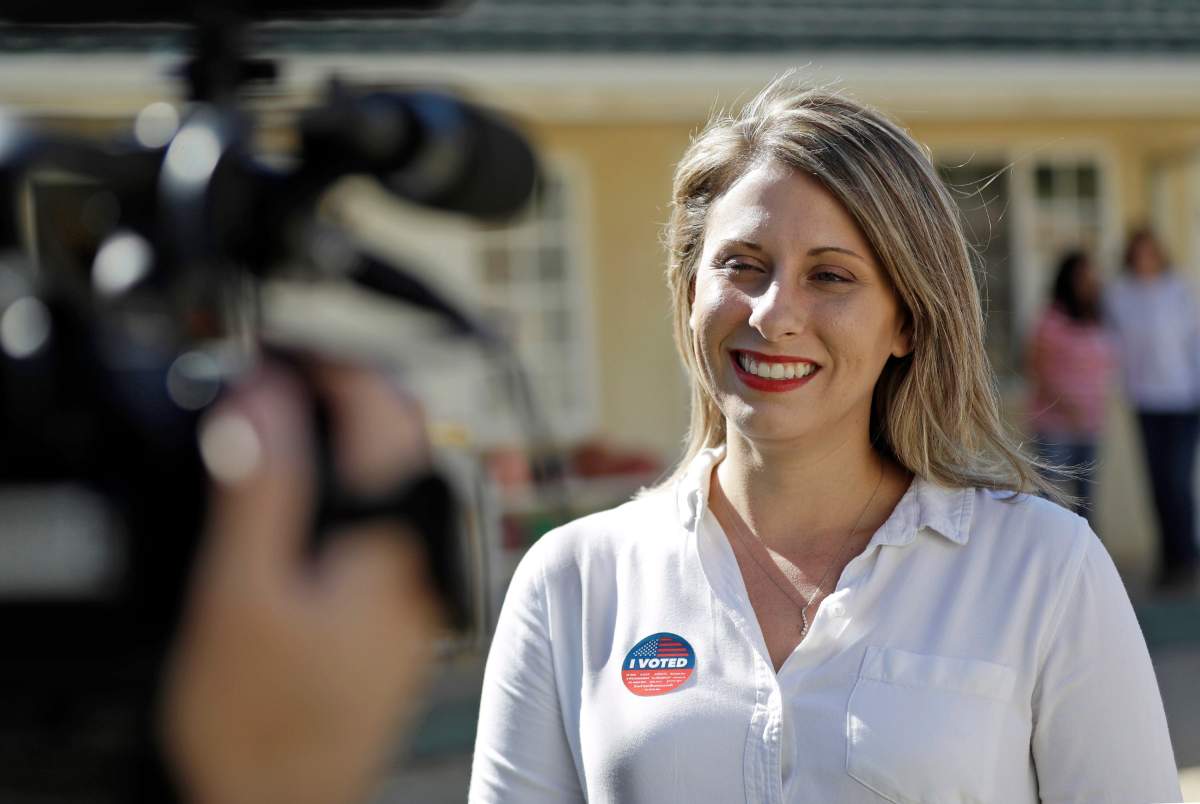 In this Nov. 6, 2018, file photo, Katie Hill, then a Democratic Party candidate from California’s 25th Congressional district, talks to a reporter after voting in her hometown of Agua Dulce, Calif. (AP Photo/Marcio Jose Sanchez, File)