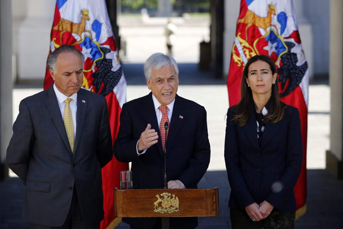 Chile’s President Sebastian Pinera announces that he is calling off the Asia-Pacific Economic Cooperation Economic Forum, APEC, and Climate Change COP25 Conference, at La Moneda presidential palace in Santiago, Chile, Wednesday, Oct. 30, 2019.