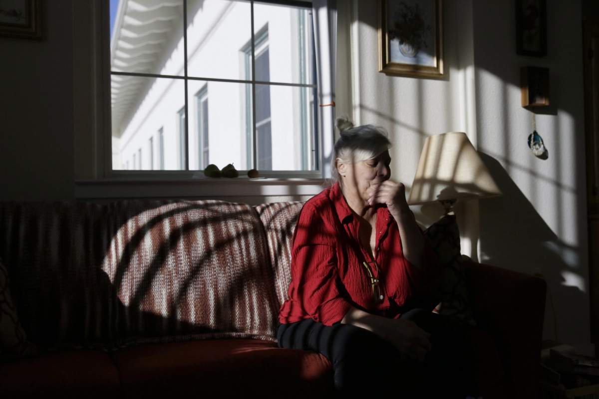 Pamela Zuzak, 70, reflects on her experiences of being stranded in the dark during the power blackouts at the Villas at Hamilton housing complex for low income seniors Wednesday, Oct. 30, 2019, in Novato, Calif. Pacific Gas & Electric officials said they understood the hardships caused by the blackouts but insisted they were necessary.