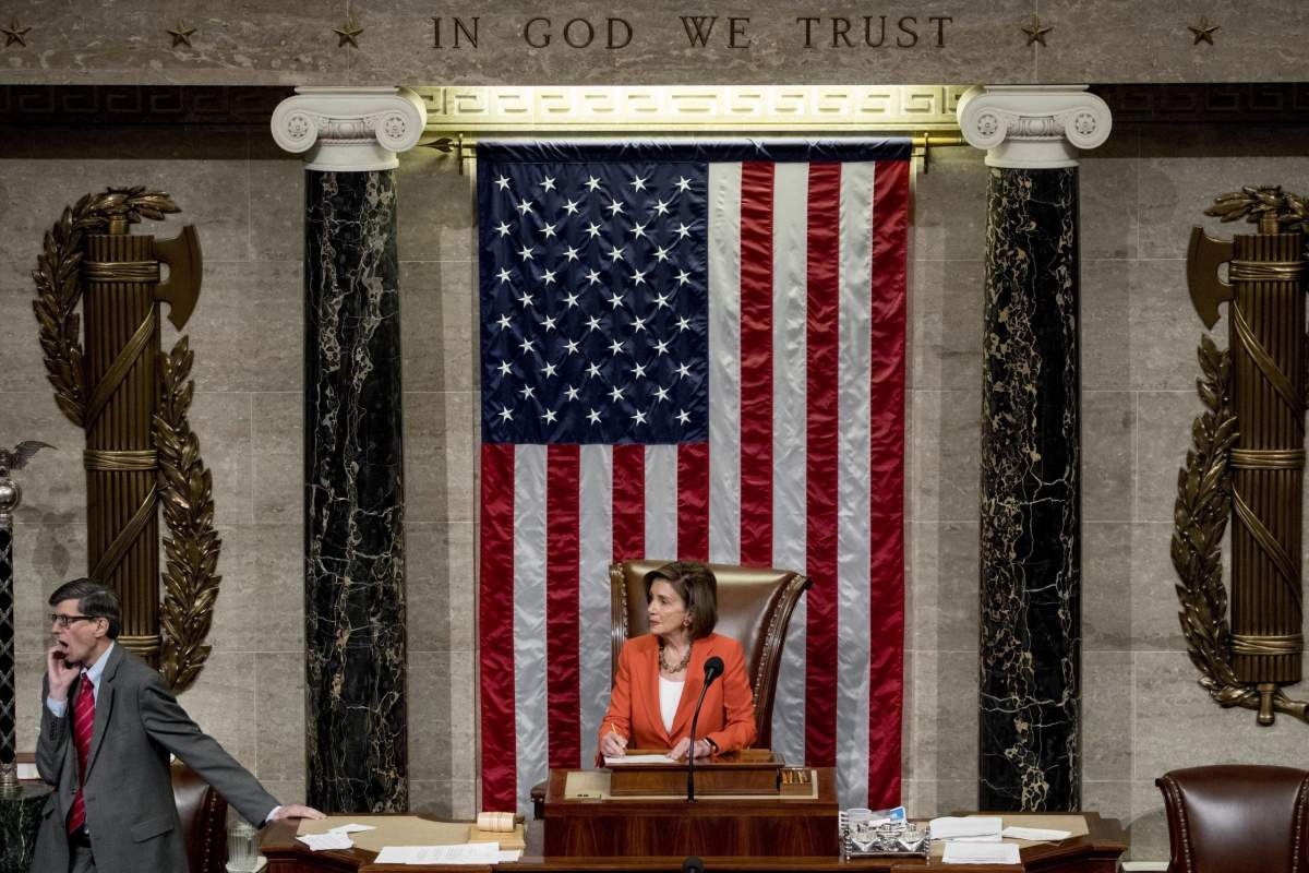House Speaker Nancy Pelosi of Calif. is seen at her chair as House members vote on a resolution on impeachment procedure to move forward into the next phase of the impeachment inquiry into President Trump, in the House Chamber on Capitol Hill in Washington, Thursday, Oct. 31, 2019. (AP Photo/Andrew Harnik)