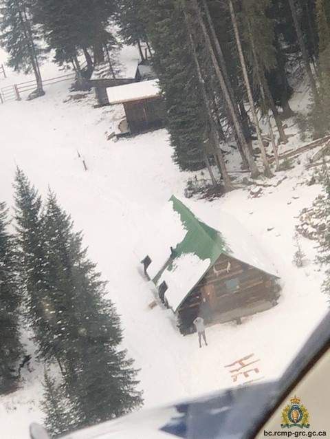 The word “help” is seen next to a remote cabin from a RCMP aircraft that was searching for a missing couple in the southeast B.C. backcountry on Oct. 31, 2019.