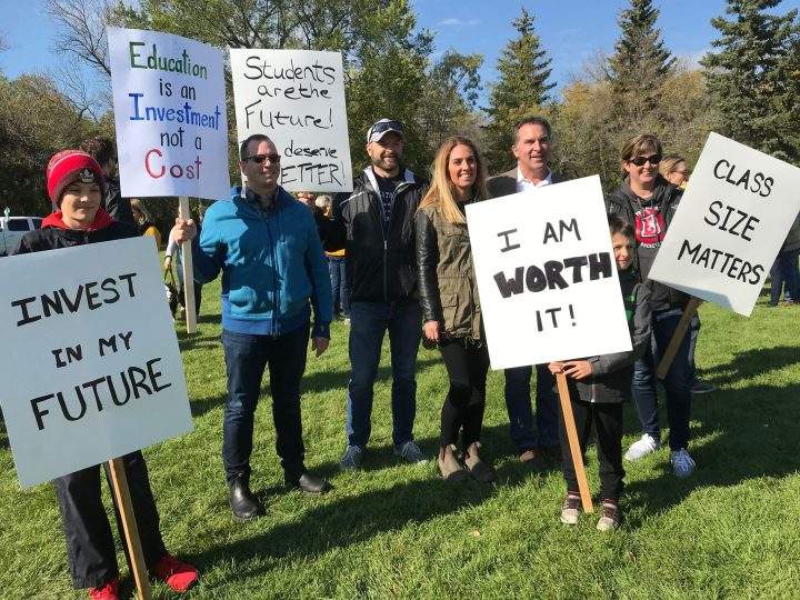 Signs held at the World Teachers Day celebrations did not hold back when it came to concerns around the education industry and its funding.