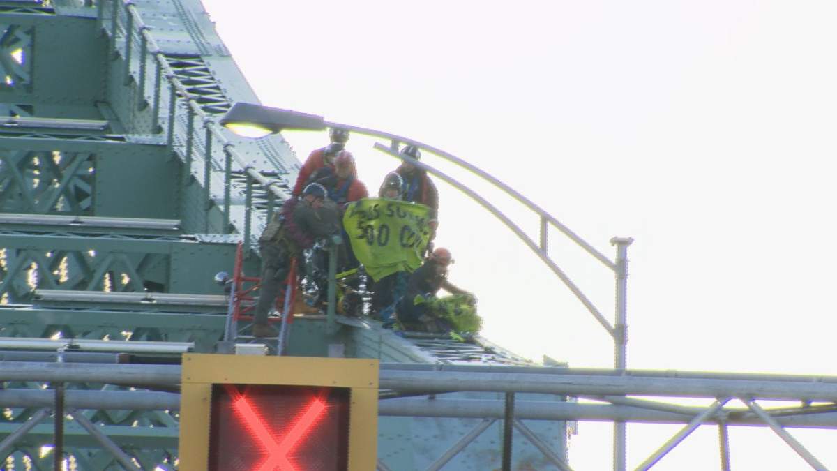 Climate activists with the Quebec chapter of Extinction Rebellion scaled the structure of Montreal's Jacques Cartier Bridge Tuesday.