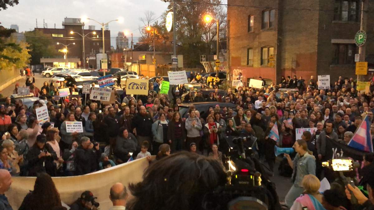 Protesters attend the Palmerston library as Meghan Murphy speaks inside.