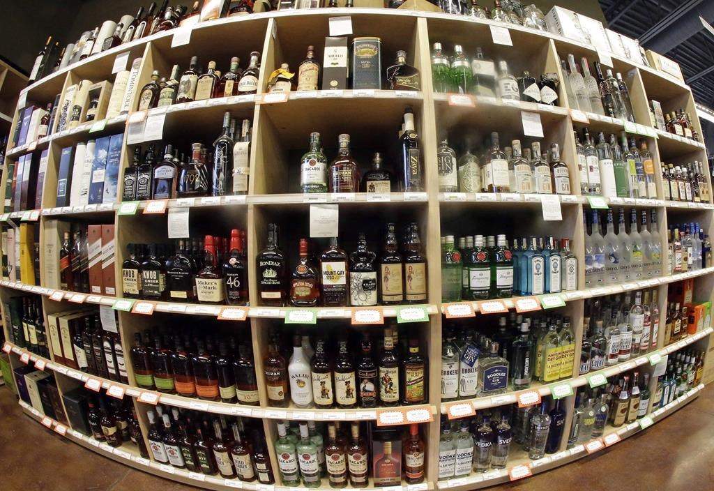 A man who reportedly attempted to thwart a robbery at a liquor store was hit by a bottle, police say.