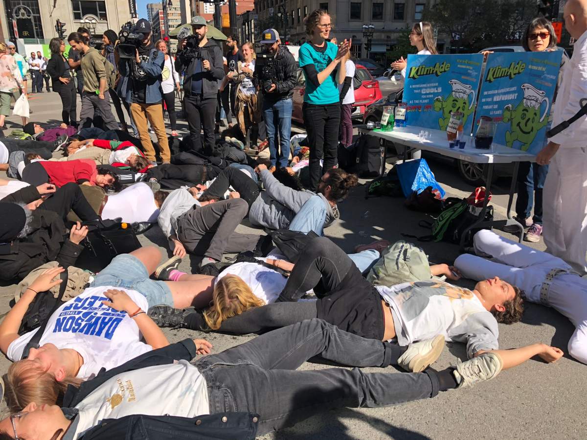 Climate activist group Extinction Rebellion perform a die-in protest in downtown Montreal on Sunday, Oct. 13, 2019.