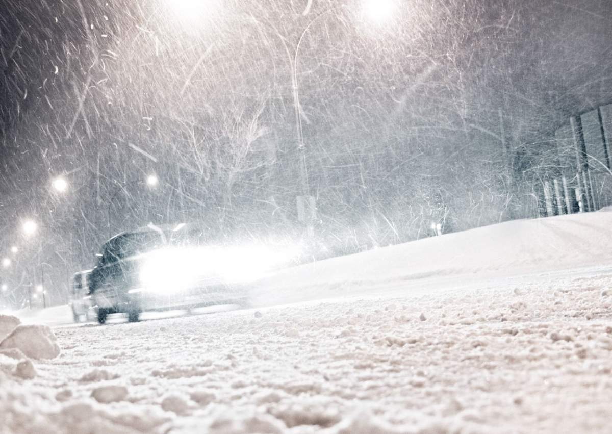 A car driving in winter conditions.