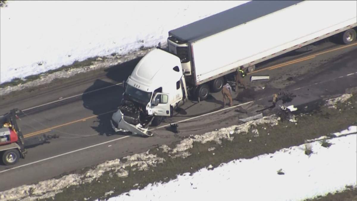 Crews clean up at the scene of a fatal semi-trailer near Granum, Alta., on Friday, Oct. 4.