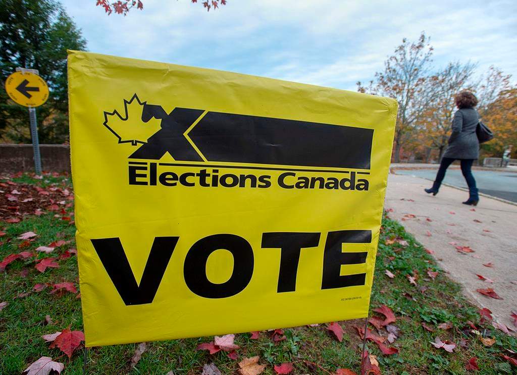 A voter heads to cast their vote in Canada's federal election at the Fairbanks Interpretation Centre in Dartmouth, N.S., Monday, Oct. 21, 2019. THE CANADIAN PRESS/Andrew Vaughan.