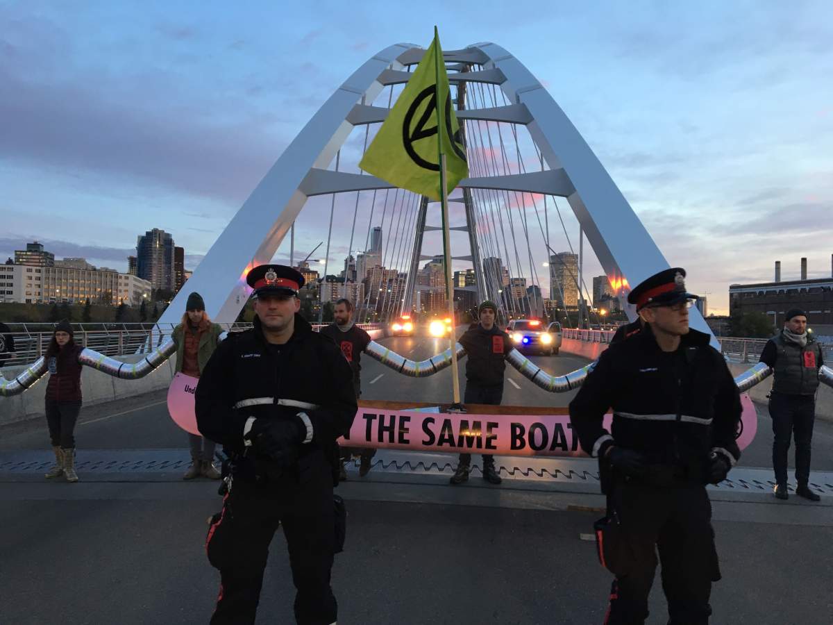 Activists with the Extinction Rebellion movement blocking the Walterdale Bridge into downtown Edmonton Monday morning as part of international protests demanding new climate policies. Monday, October 7, 2019.