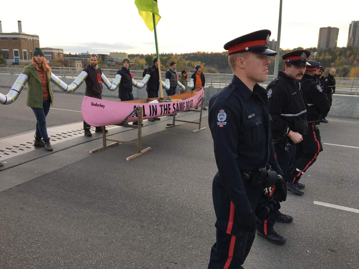 Activists with the Extinction Rebellion movement blocking the Walterdale Bridge into downtown Edmonton Monday morning as part of international protests demanding new climate policies. Monday, October 7, 2019.