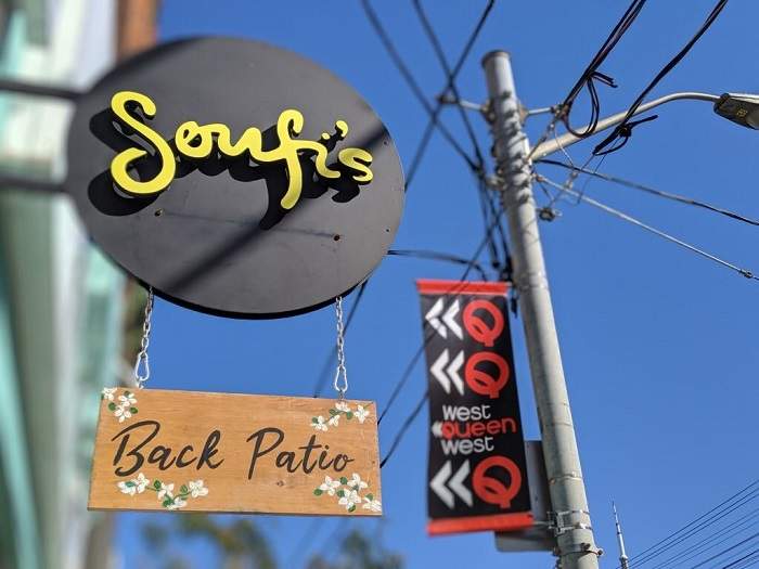 The sign for Soufi's restaurant downtown which says it has closed its door due to hate messages and death threats.