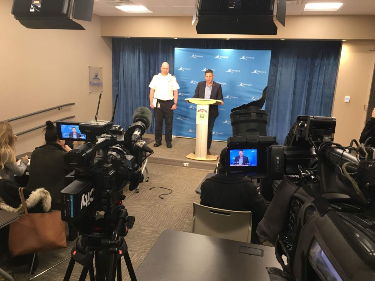 Jason Shaw, left, and Mayor Brian Bowman update media Saturday.