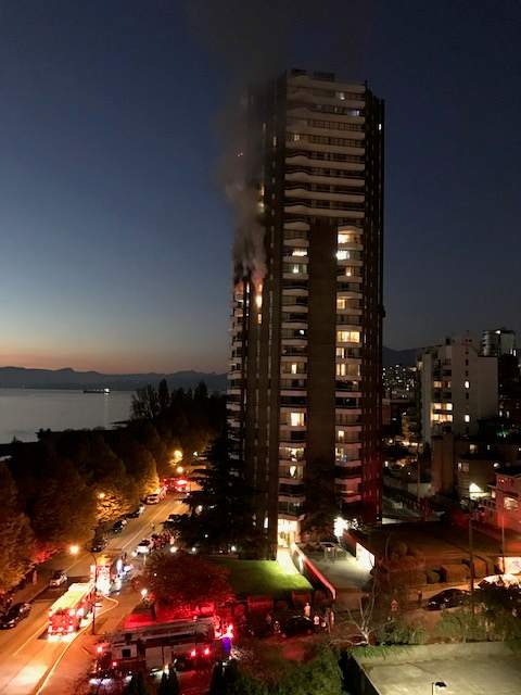 Smoke and flames pour out of a West End apartment building on Oct. 31, 2019.