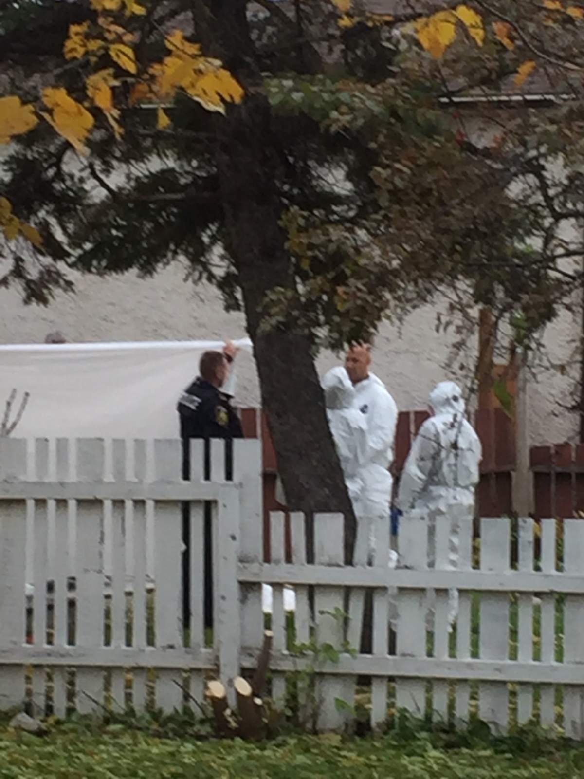 Winnipeg police at the homicide scene in Elmwood where a man was shot by officers Friday morning.