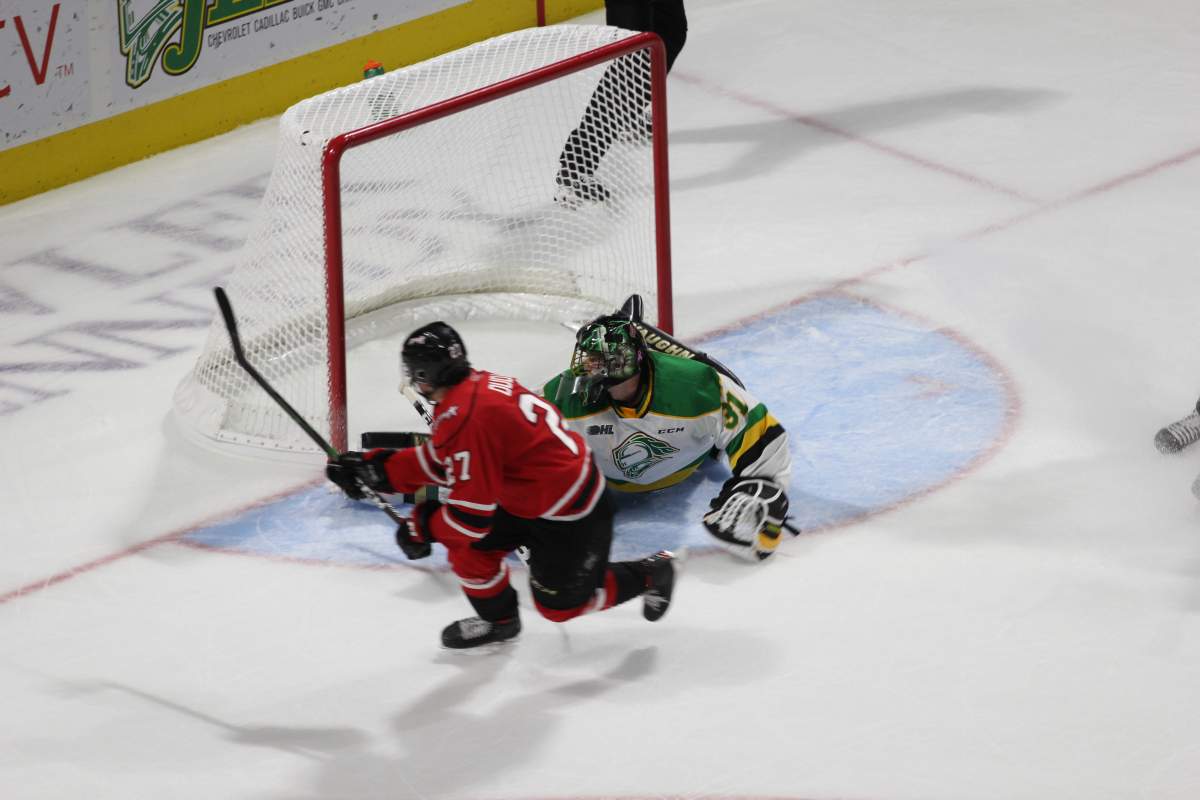 London Knights goaltender Jordan Kooy denies Owen Sound's leading scorer Aiden Dudas on a breakaway in overtime.