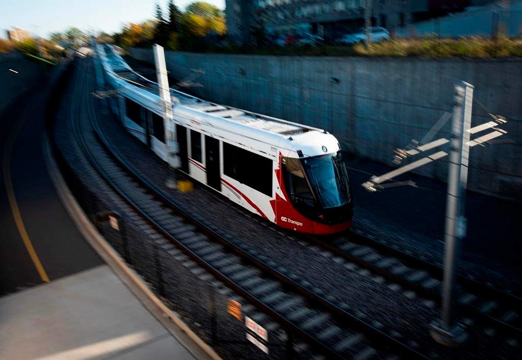 An LRT train on OC Transpo's new O-Train Confederation Line departs Lees Station in Ottawa, on Friday, Oct. 11, 2019.