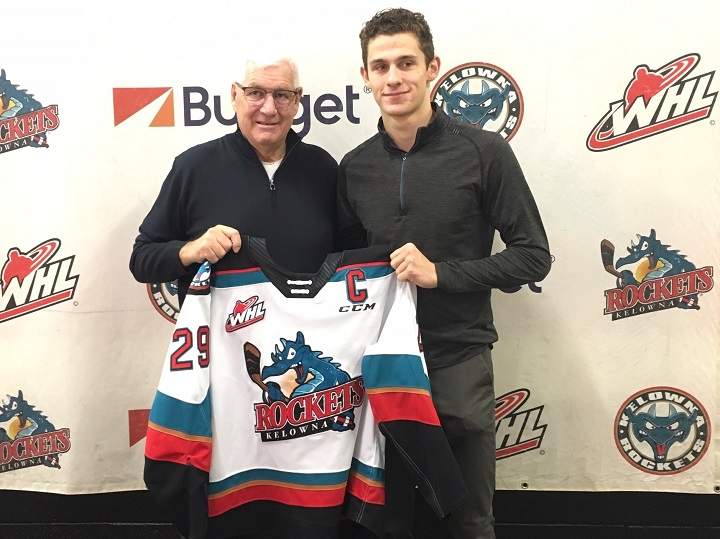 Kelowna Rockets president and GM Bruce Hamilton, left, and forward Nolan Foote hold a jersey after Foote was named team captain on Friday morning.
