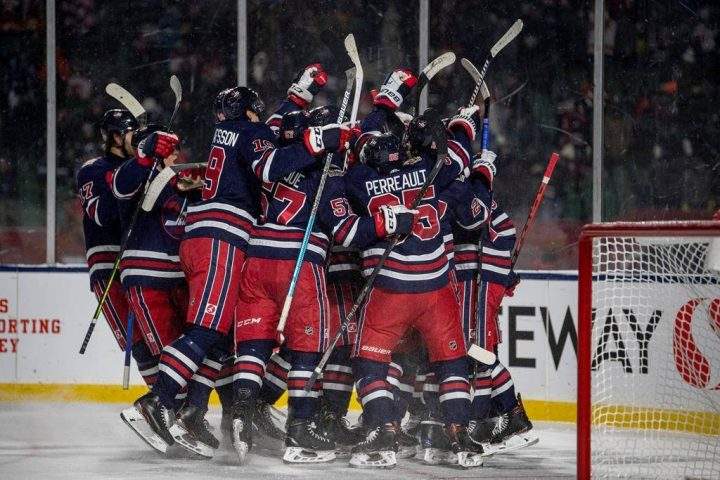 The Winnipeg Jets celebrate their win over the Calgary Flames in overtime of the NHL Heritage Classic outdoor hockey game in Regina on Saturday, Oct. 26, 2019. The Jets defeated the Flames 2-1. THE CANADIAN PRESS/Liam Richards