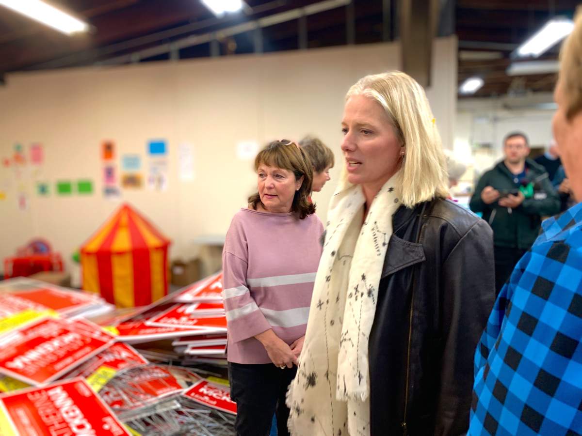 Environment Minister Catherine McKenna speaks with reporters and her office staff on Thursday.