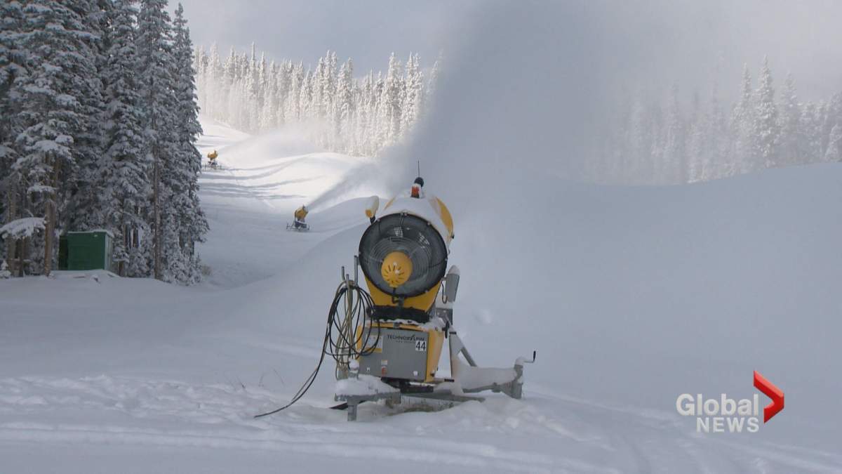 Snowmakers working at Nakiska Ski Area on Oct. 9.