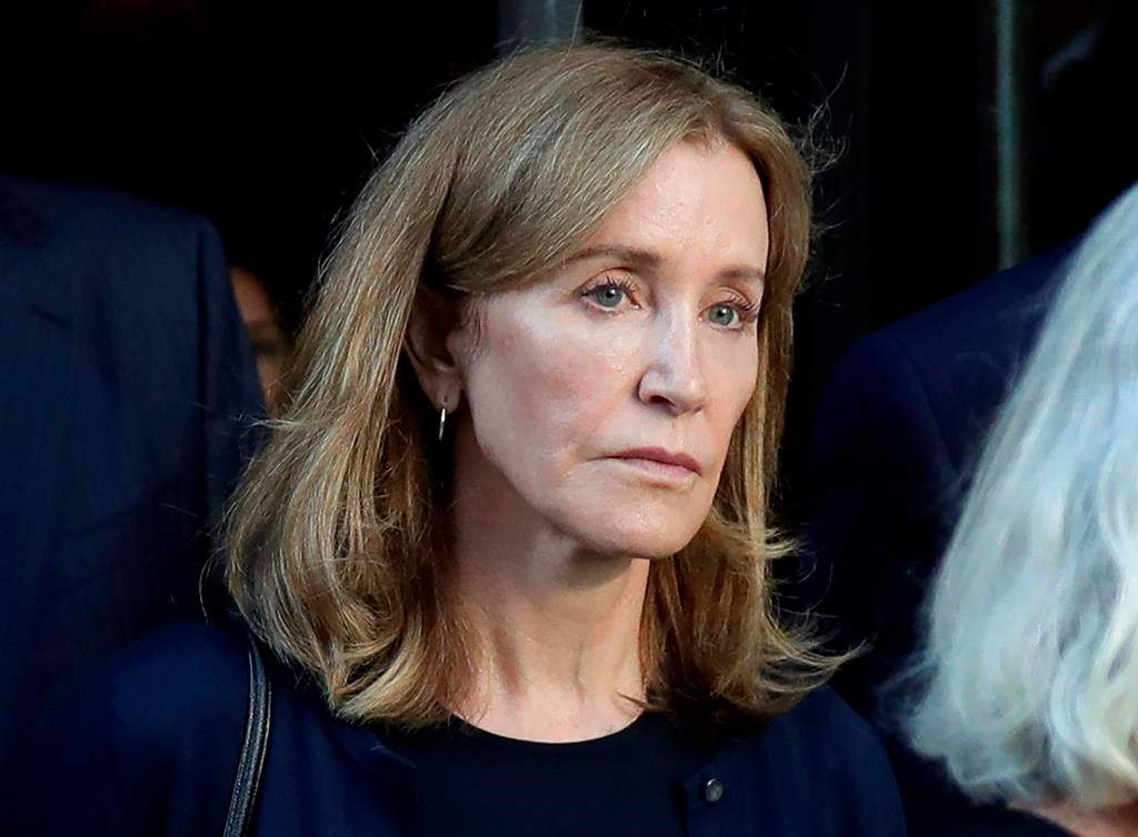 Actress Felicity Huffman leaving federal court after her sentencing in a nationwide college admissions bribery scandal in Boston.