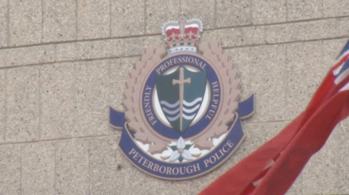 A Peterborough woman is accused of assaulting two emergency service workers.