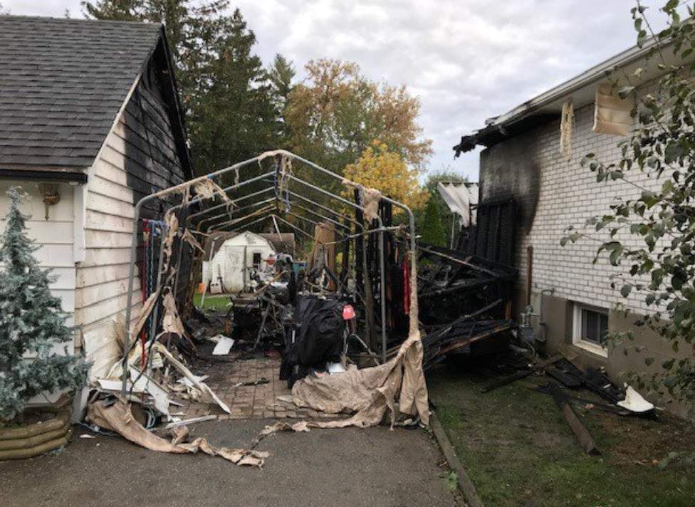 London fire crews battled a fire at a pool shed and two neighbouring homes on Friday morning.