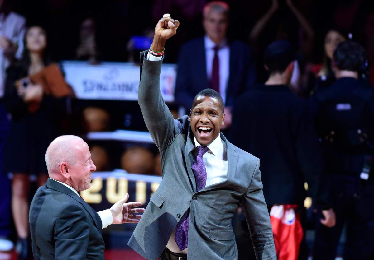 Toronto Raptors president Masai Ujiri receives his 2019 NBA championship ring from Larry Tanenbaum, chairman of Maple Leaf Sports & Entertainment, before playing the New Orleans Pelicans in Toronto on Tuesday Oct. 22, 2019.