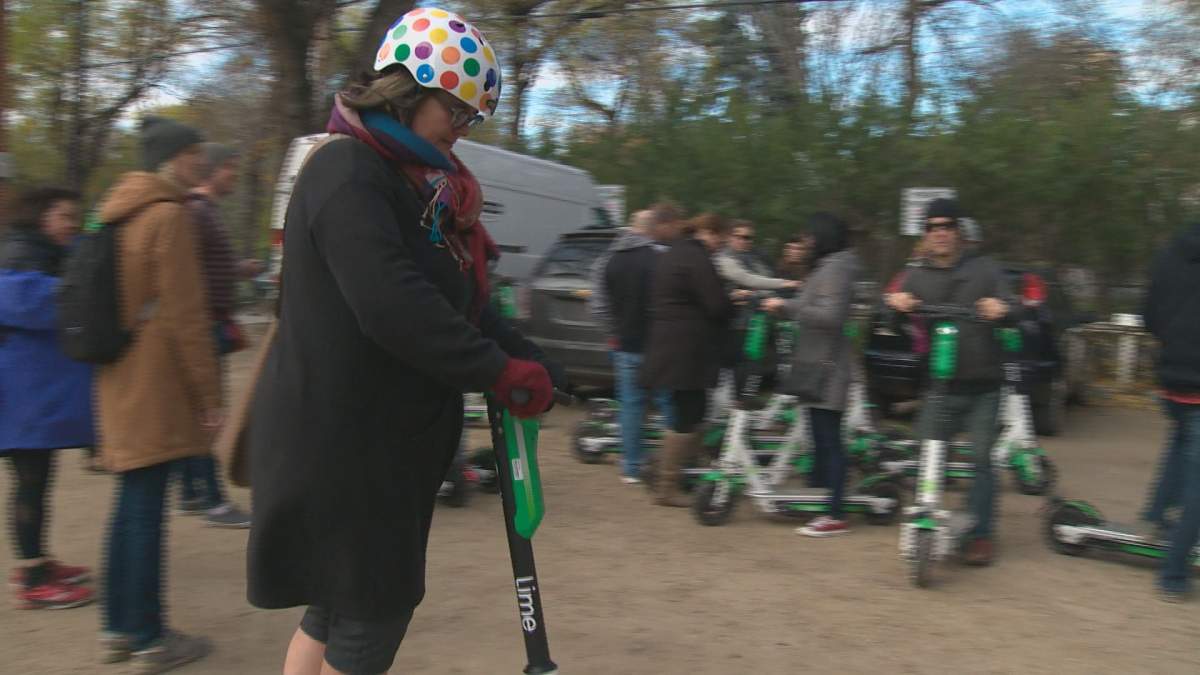 Participants prepare to take off on an e-scooter tour of Edmonton. 