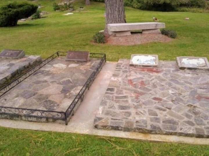 A photo showing two headstones with missing plaques at the Naramata Cemetery.