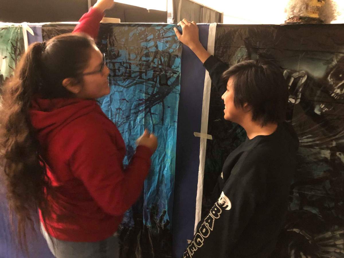 Students at Sunchild First Nation School put the finishing touches on a homemade haunted house. 