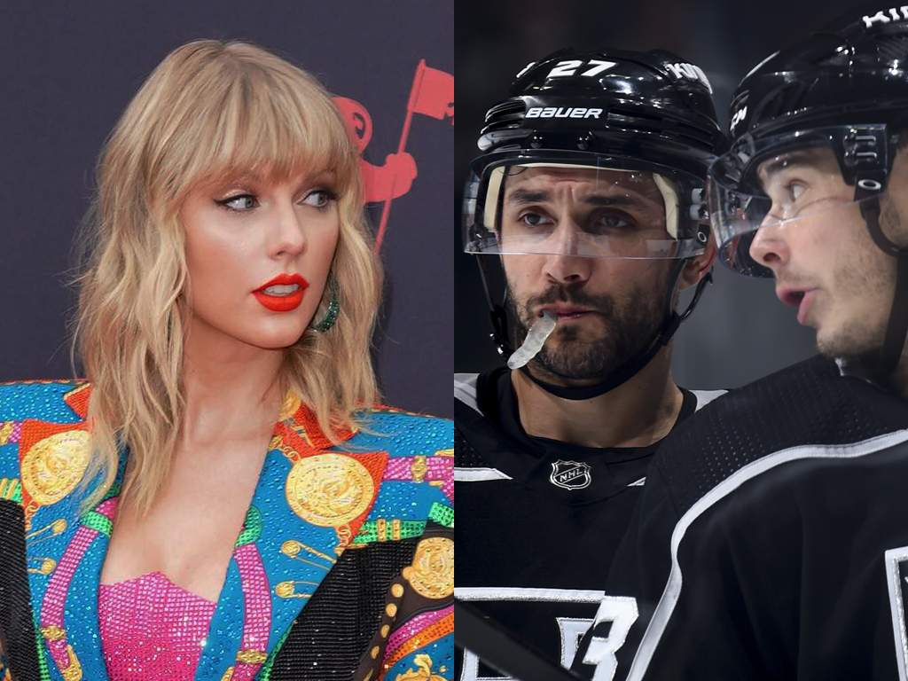 (L-R) Taylor Swift and the L.A. Kings' Alec Martinez (#27) and Dustin Brown (#23) in 2019.