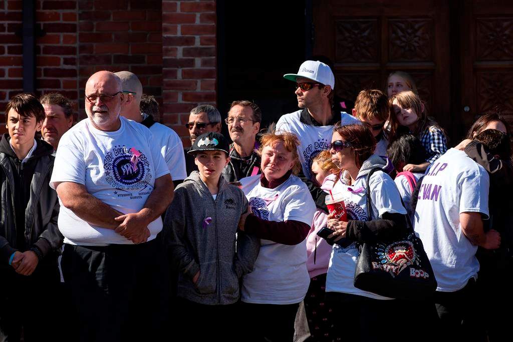 Shari-Ann Selvey, the mother of Devan Bracci-Selvey, centre, looks on during a procession following her son’s funeral service at Stoney Creek United Church in Hamilton, Ont., Saturday, Oct. 12, 2019.  THE CANADIAN PRESS/Tara Walton