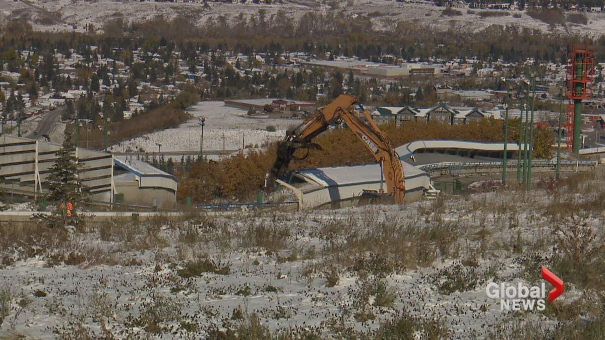 Crews are seen doing renovation work on the sliding tracks at WinSport.