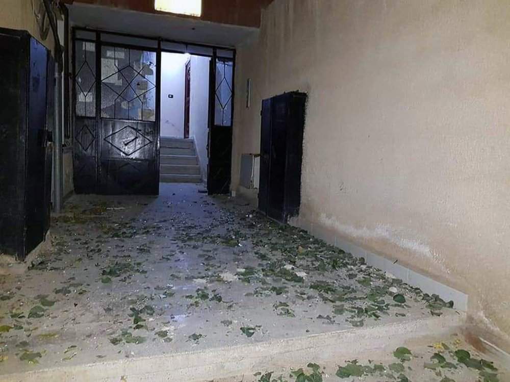 In this photo released by the Syrian official news agency SANA, a damaged building targeted by Israeli missile strikes is seen in the Qudsaya suburb, west of the capital Damascus, Syria, Wednesday, Nov. 20, 2019. The Israeli military on Wednesday said it struck dozens of Iranian targets in Syria, carrying out a "wide-scale" strike in response to rocket fire on the Israeli-controlled Golan Heights the day before. 