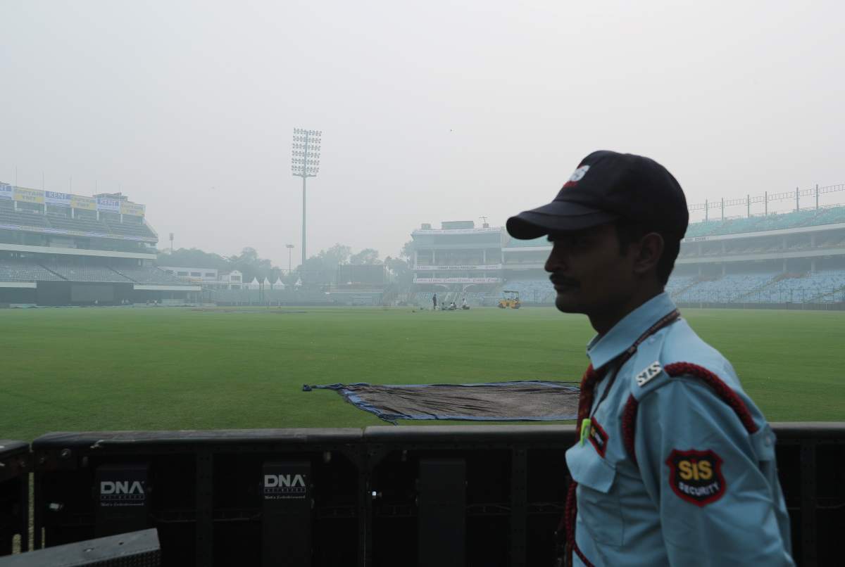 A security guard stands amidst smog during a practice session of Bangladesh ahead of their Twenty20 cricket match against India in New Delhi, India, October 31, 2019. REUTERS/Adnan Abidi