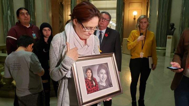 Linda Roberts holds a photo of her daughter Jadene, who died by suicide. She was 14. 