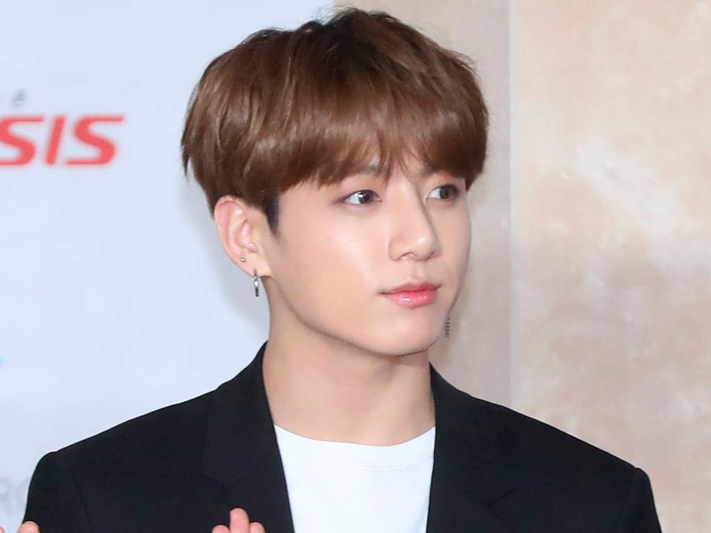 In this Nov. 28, 2018, photo, a member of K-pop group BTS, Jungkook, poses for the media at the Asia Artist Awards in Incheon, South Korea. Police say they are investigating Jungkook over a traffic accident on Saturday, Nov. 2, 2019, involving the band member and a taxi driver.