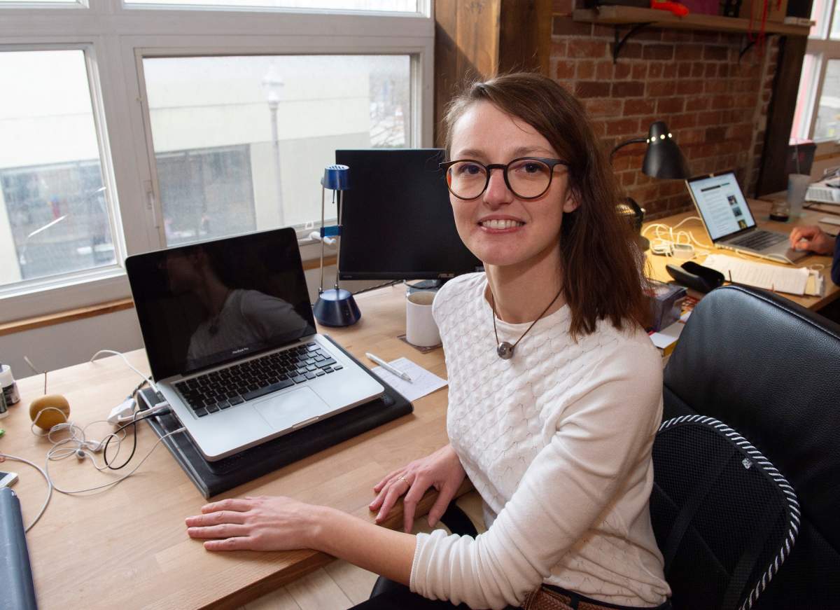 Emilie Dubois is shown in her office Friday, November 8, 2019 in Quebec City. There's little doubt in Dubois' own mind about her ability to speak French — after all, it's her native tongue. But the Quebec government doesn't see Dubois' bona fides the way she does, having denied her permanent residency in the province because part of her PhD thesis was written in English.
