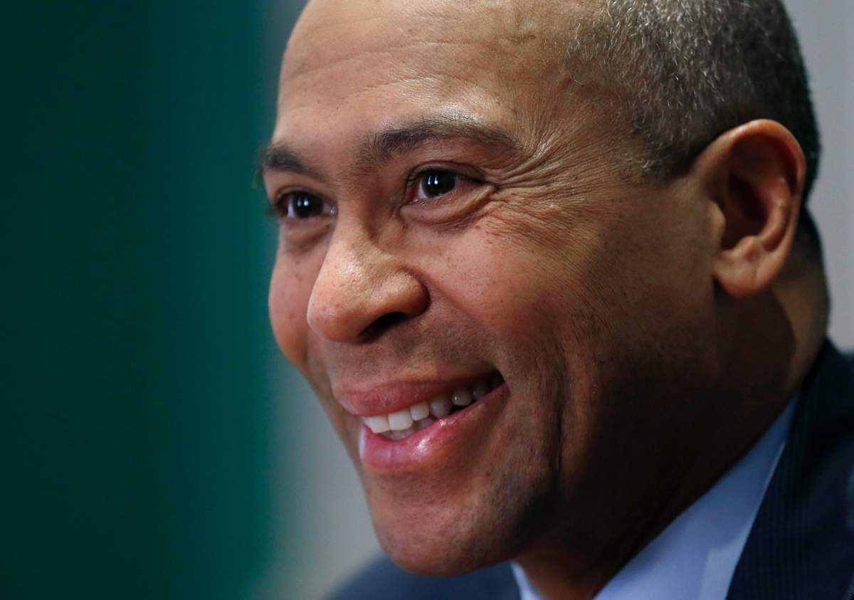 FILE - In this Dec. 15, 2014, file photo, Massachusetts Gov. Deval Patrick speaks during an interview at his Statehouse office in Boston. Former Massachusetts Gov. Patrick is considering making a late run for the Democratic presidential nomination. That is according to people with knowledge of Patricks deliberations. (AP Photo/Elise Amendola, File).