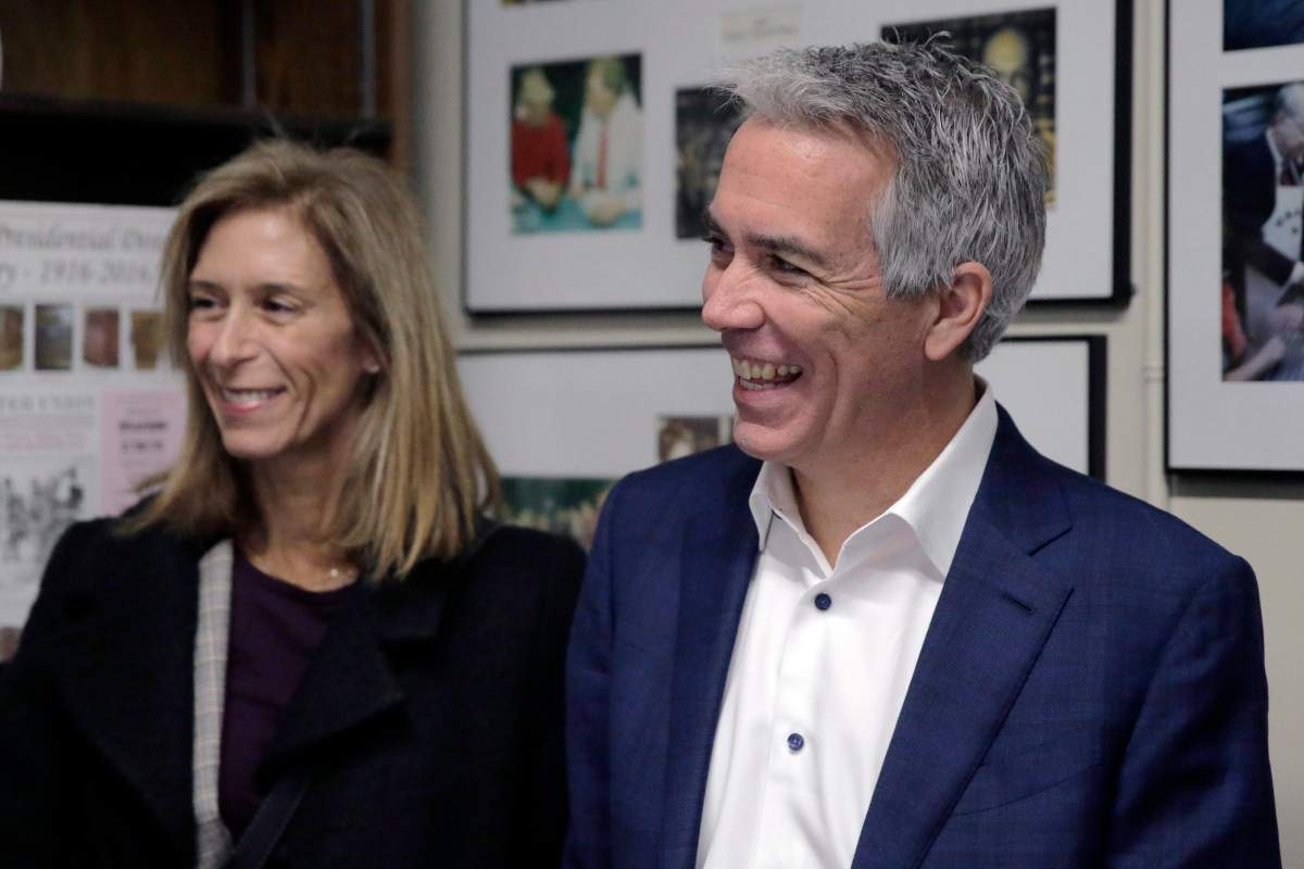 Republican presidential candidate former U.S. Rep. Joe Walsh, R-Ill., arrives with his wife Helene Walsh to file to have his name listed on the New Hampshire primary ballot, Thursday, Nov. 14, 2019, in Concord, N.H.