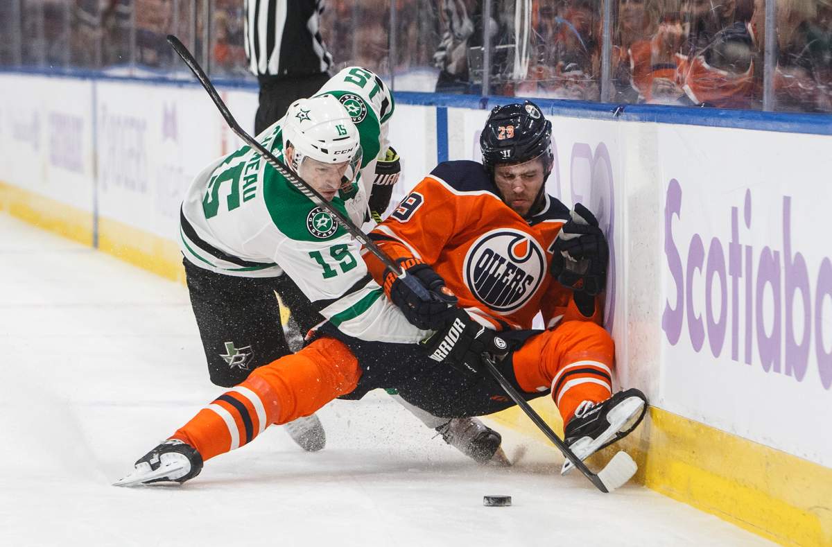 Dallas Stars' Blake Comeau (15) checks Edmonton Oilers' Leon Draisaitl (29) during second period NHL action in Edmonton, Alta., on Saturday November 16, 2019. THE CANADIAN PRESS/Jason Franson.