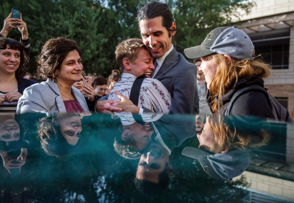 Scott Warren celebrates his verdict outside the Federal Courthouse outside the Federal Courthouse on Nov. 20, 2019 in Tucson, Ariz.