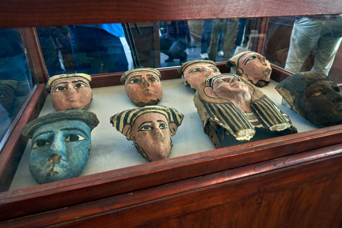 Wooden and clay mummies masks are displayed in Saqqara, south Giza, Egypt on Nov. 23, 2019.