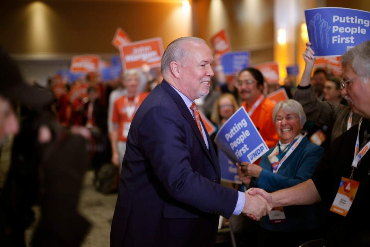 Premier John Horgan arrives to deliver his speech during the BC NDP Convention at the Victoria Convention Centre in Victoria, Saturday, Nov. 23, 2019.