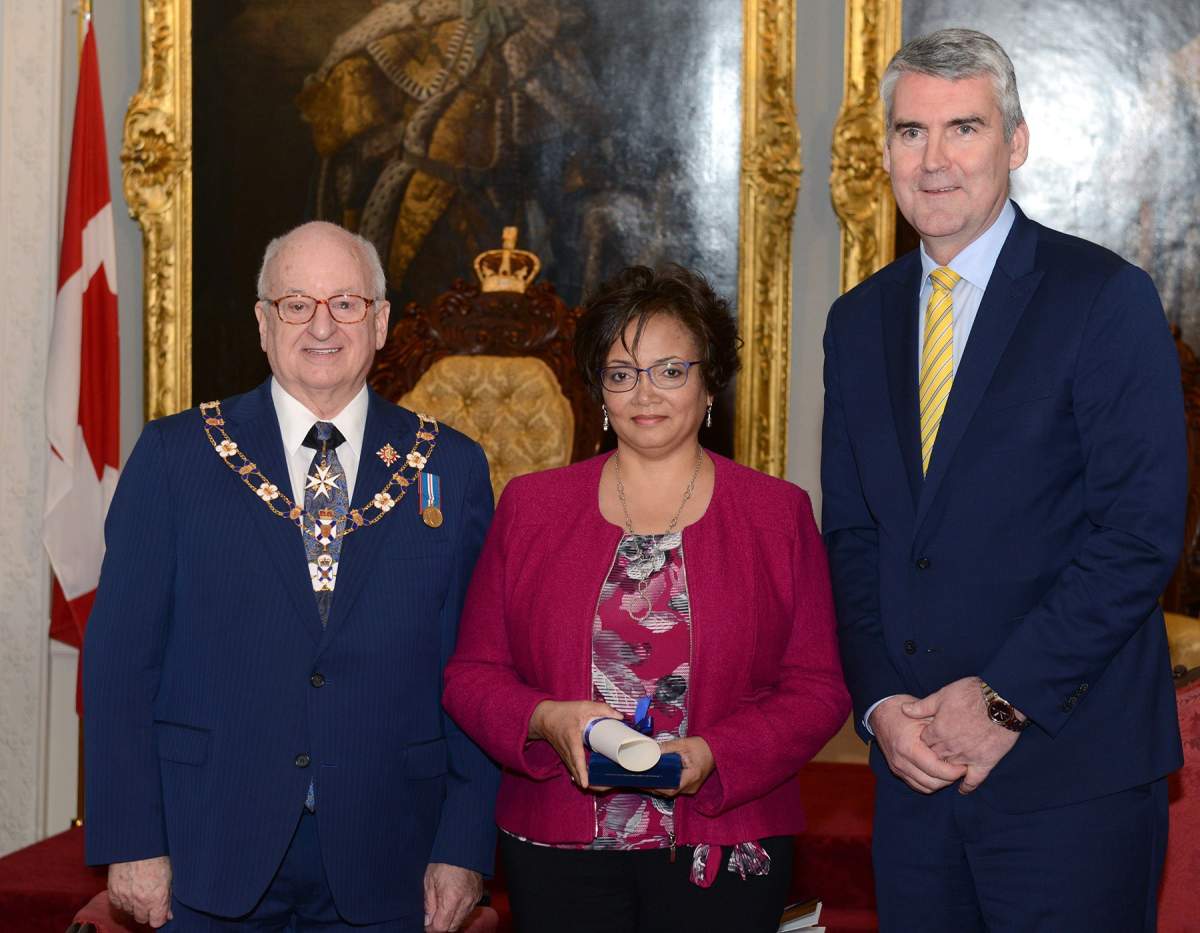 Elizabeth Ann Cromwell daughter Mary Crowell poses with with Lt.-Gov. Arthur LeBlanc and Premier Stephen McNeil in Halifax on Tuesday Nov. 26, 2019.
